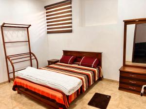 a bedroom with a bed and a american flag at River Side Guest House in Hatton