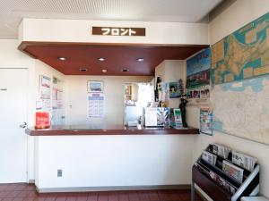 a waiting area of a restaurant with a map on the wall at Tabist Hotel New Nemuro in Nemuro
