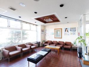a waiting room with couches and chairs in a hospital at Tabist Hotel New Nemuro in Nemuro +47 photos
