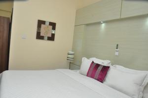 Uma cama ou camas num quarto em Citiheight Hotel