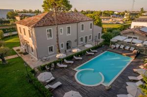 an aerial view of a house with a swimming pool at San Giovanni Relais in San Giovanni in Marignano