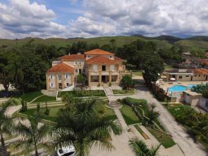 an aerial view of a large house with a pool at Hotel La Ponsa Itatiaia in Itatiaia