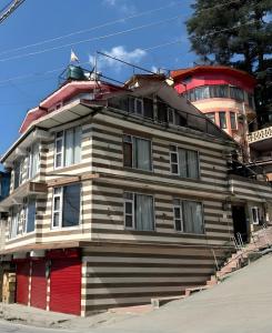 a wooden house on the side of a street at Golden Glow Stays in Shimla