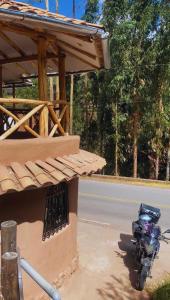 a motorcycle parked on the side of the road at Apu House in Calca