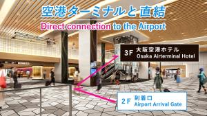 a sign in an airport with people walking in a mall at Osaka Airterminal Hotel in Toyonaka