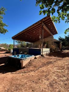 a building with a hot tub in front of it at Kit inn Wetrock in Moab