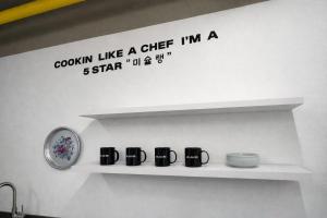 a shelf with a sign that says goourn like a chef im a star at JE JA RI Stay in Seoul