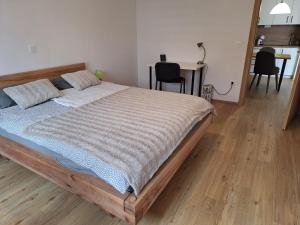 a bedroom with a bed and a table and chairs at Apartma San Izola - near the beach San Simon in Izola