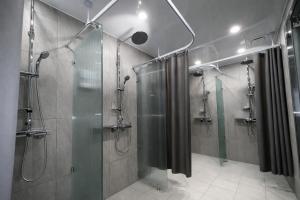 a bathroom with a shower and a glass shower stall at JE JA RI Stay in Seoul +20 photos