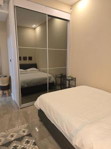 a bedroom with two beds and a mirror at Luxury Queen Mountian in Eilat