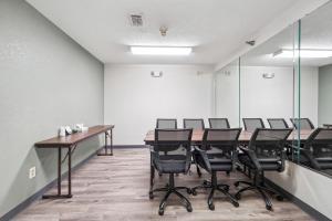a conference room with a long table and chairs at Quality Inn & Suites Dawsonville in Dawsonville +56 photos