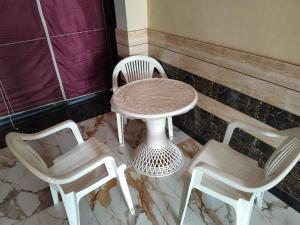 a table and two chairs and a table and chairs at Shobhit homestay in Amroha