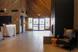 a lobby with a couch and a chair in a room at The Kendrick Hotel, an Ascend Collection Hotel in Flagstaff +24 photos