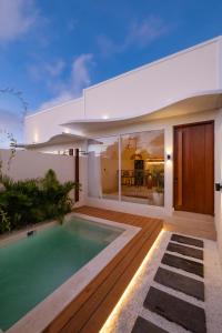 an image of a villa with a swimming pool at Nyaman lima Villas in Canggu