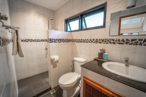 a bathroom with a toilet and a sink at Malee Beach C6 in Phra Ae beach +11 photos