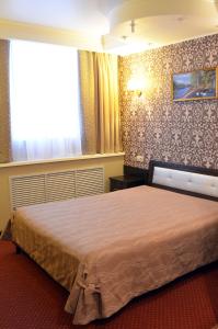 Cama o camas de una habitación en Dukat Hotel on Ibragimova