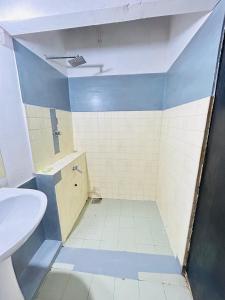 a bathroom with a toilet and a sink at evol Hotel Battaramulla in Battaramulla +16 photos