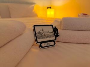 a picture of a city on a bed at Sibiutiful - Ultracentral in Sibiu