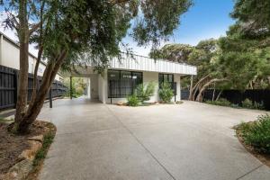 an empty driveway in front of a building at The Hudson with Heated Pool in Rye