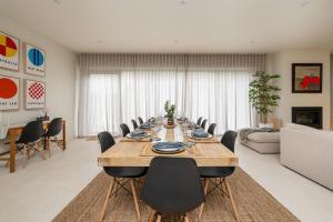 a large dining room with a long table and chairs at The Hudson with Heated Pool in Rye +30 photos