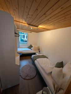 a small room with a bed and a couch at KREIDESEE 47 - Hemmoor in Hemmoor