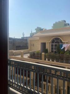a view of a building from a balcony at Vansh Residency Couple Friendly Near Rajiv Chowk Gurgaon in Gurgaon