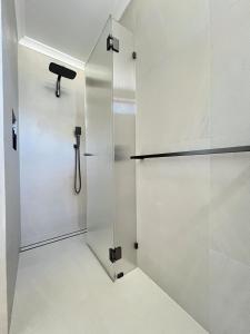 a shower stall in a bathroom with white walls at il Villinno on Dalton - Great Location in Mosman Park +32 photos