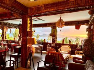 a living room with a view of the ocean at LE CHISSIOUA in Sada