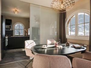 a kitchen and dining room with a table and chairs at Hotel Sieghard Zillertal in Mayrhofen +40 photos