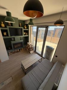 a living room with a couch and a fireplace at Bakuriani in Bakuriani