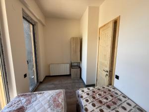 a small room with a bed and a door at Bakuriani in Bakuriani