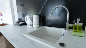 a kitchen counter with a sink in a kitchen at Wellocum in Serock