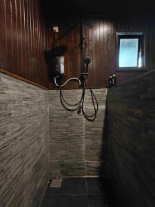 a shower in a bathroom with a shower at Melina Beach Resort in Tioman Island