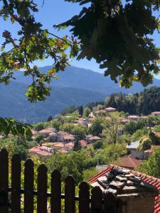 a view of a town from behind a fence at ΤΟ ΑΡΧΟΝΤΙΚΟ in Kríkellon