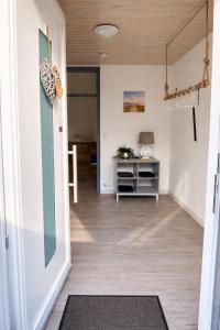 a hallway with a door leading to a living room at Charmante FeWo in Dorflage in Ebersdorf