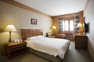 Postel nebo postele na pokoji v ubytování Commodore Hotel Busan