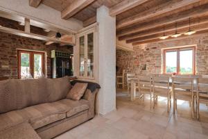 a living room with a couch and a table at Villa Miranda Hvar in Stari Grad