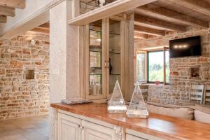 a kitchen with two sailboats on a wooden counter at Villa Miranda Hvar in Stari Grad