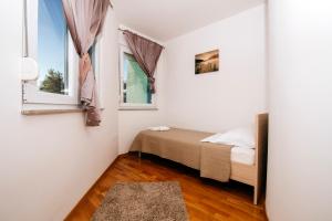 Łóżko lub łóżka w pokoju w obiekcie Rainbow apartments