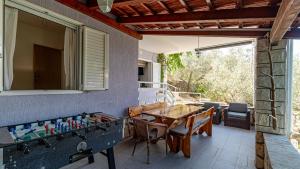a room with a ping pong table and agamuitous at Villa Naty with Whirlpool by Villas Guide in Vela Luka