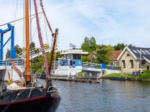 a boat is docked next to a dock at De Rakken in Woudsend