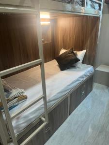 a bunk bed with a pillow on top of it at Shiv ghar Stay in Varanasi