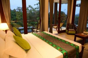 a bedroom with a bed with a view of a balcony at Moon Lanka Hotel Hikkaduwa in Hikkaduwa +103 photos