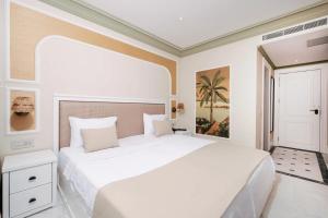 a white bedroom with a large white bed in it at DBD Hotel Çeşme in Yumru +21 photos