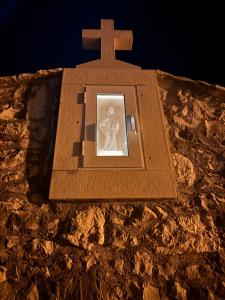 a picture of a cross on top of a mountain at Visilo Heritage Stone House - A 300-year-old Legacy in the Heart of Pučišća in Pučišća