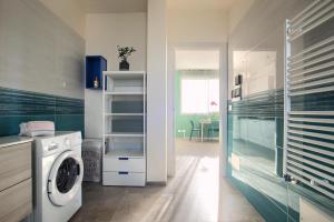 a kitchen with a washer and a washing machine at Iris - Costadoro Holiday Home in Imperia
