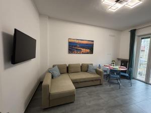 a living room with a couch and a table at Arcobaleno in Turin