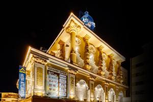 a building with a clock tower on top of it at HOTEL ATLANTIS IKUTAMA -Adult Only in Osaka