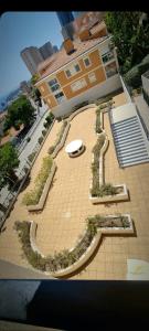 an aerial view of a building with a garden at Proche de Monaco appartement devant piscine in Beausoleil