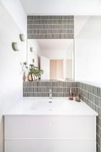 a bathroom with a sink and a mirror at Genesis-Loft Madrid in Madrid +31 photos